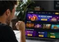 Player browsing online casino promotions and evaluating a no deposit bonus offer on a laptop.